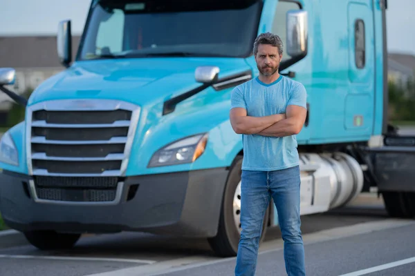 Men driver near lorry truck. Truck driver. Trucking owner. Transportation vehicles. Handsome man posing in front of truck. Semi trucks vehicle