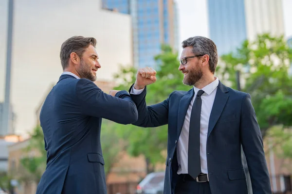 stock image American businessman shaking hands with partner. Business men in suit shaking hands outdoors. Handshake. Two business team, collaboration to the success of businessmen. Partnership, business strategy