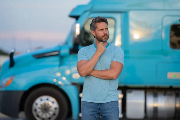 Men driver near lorry truck. Man owner truck driver near truck. Handsome middle aged man trucker trucking owner. Transportation industry vehicles. Handsome man driver front of truck