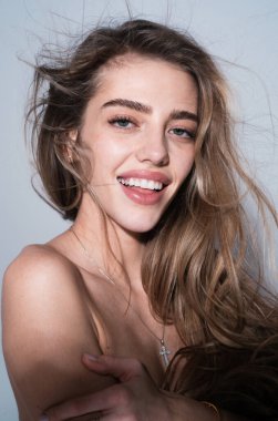 Beauty romantic happy smiling woman face close-up. Beautiful luxury makeup. Portrait of happy young woman