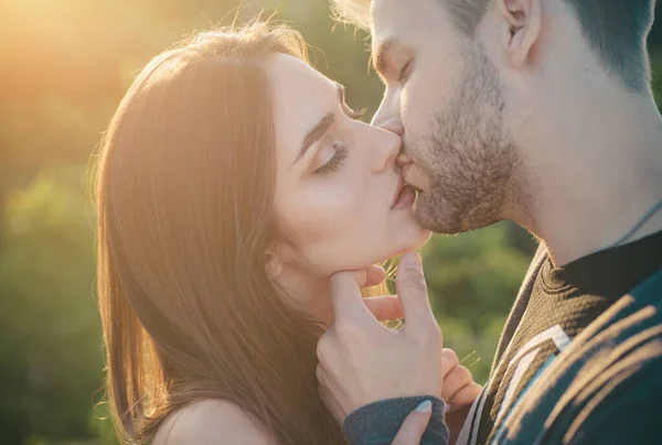 Couple kissing. Touching face ecstasy and pleasure. Making kiss to young lover. Sensual couple make kiss. Young lovers. Affectionate couple caressing adoring each other