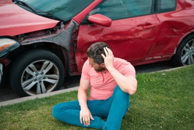 Driver shocked near car after accident. A young man in despair clutched his head, car broke down on the road clipart