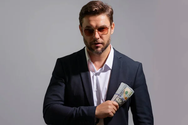 Business man holding lots of 100 dollar bills. Easy money credit. Businessman holding cash dollar bills on white. Business man with money. Rejoices to win business. Business man hold cash money