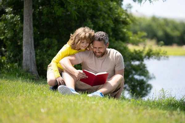 Lovely Family Reading Book Grass Boy Dad Having Picnic Park — Stock Photo, Image