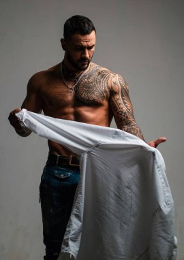 Sexy man undressing shirt. Sexual desire. Sensual guy clipart