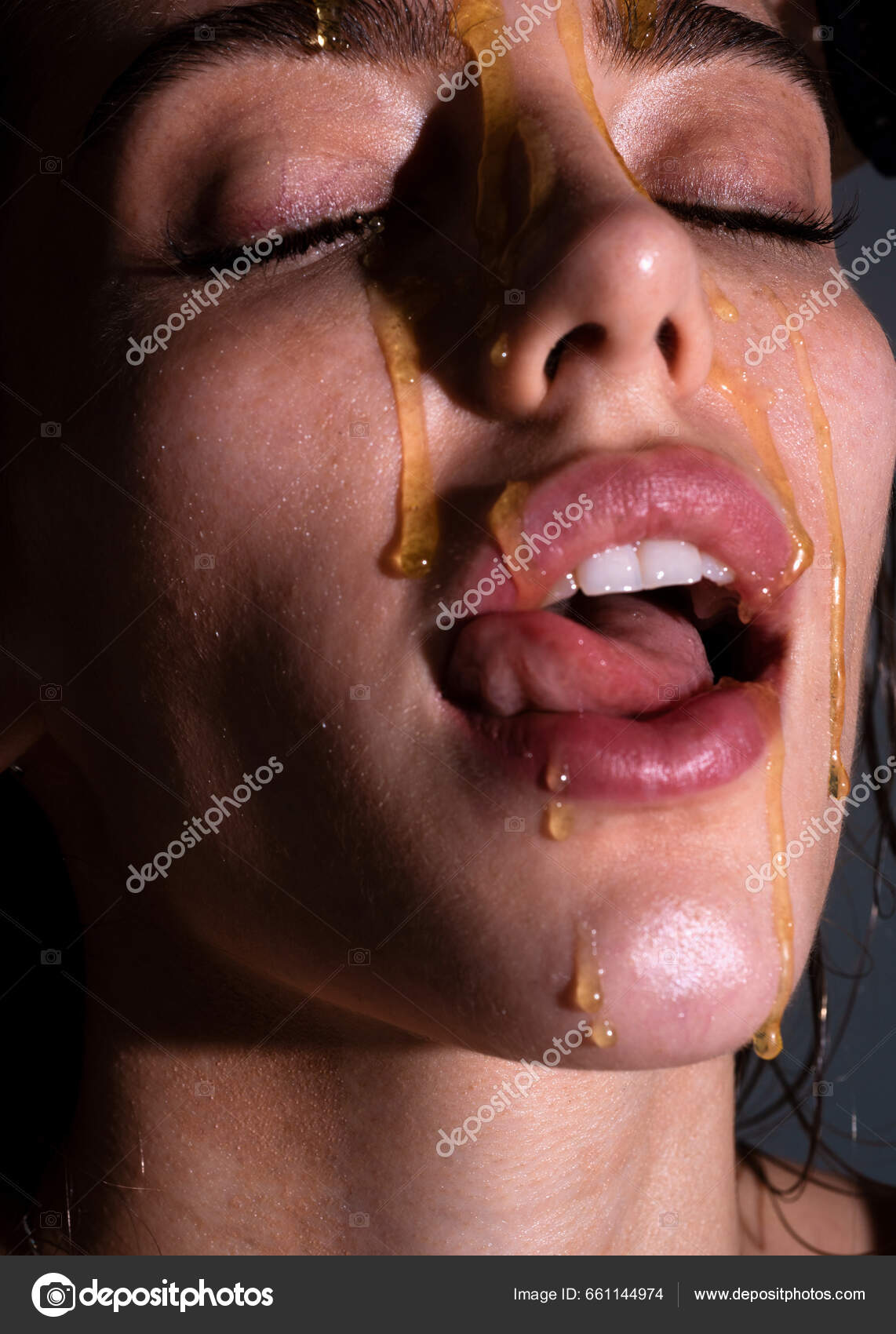 Sensual Young Woman Face Honey Drop Close Beautiful Girl Tongue Stock Photo  by ©Tverdohlib.com 661144974