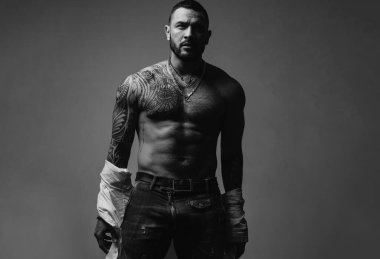Improving his physique with testosterone. Strong hispanic man full of testosterone. Athletic latino man showing muscular body and six pack abs, testosterone concept. High testosterone level.