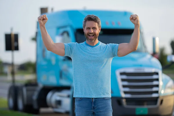 Men driver near lorry truck. Truck driver. Trucking owner. Transportation vehicles. Handsome man posing in front of truck. Semi trucks vehicle