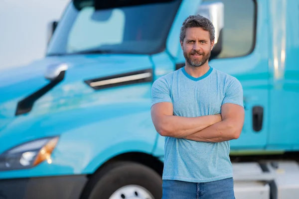 Men driver near lorry truck. Man owner truck . Serious middle aged man trucker trucking owner. Transportation industry vehicles. Handsome man driver front of truck