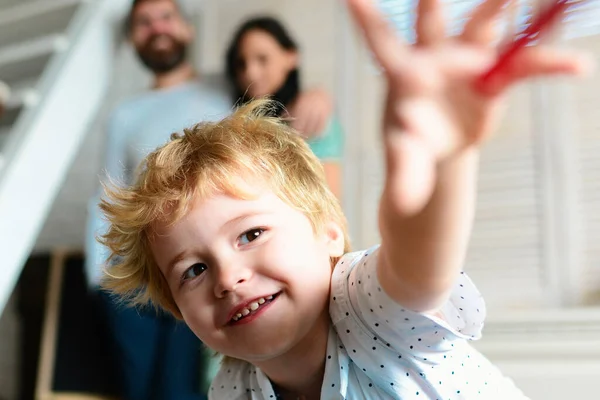 stock image Children day. Happy family mother, father and child. Happy family with children on weekend. Young parents and their child are very happy at home. Funny kids face