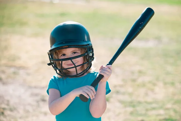 Baseball kid players in helmet and baseball bat in action