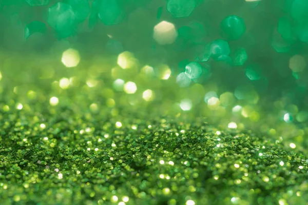 Spring sparkle background. Green colorful sparkles. Abstract advertising