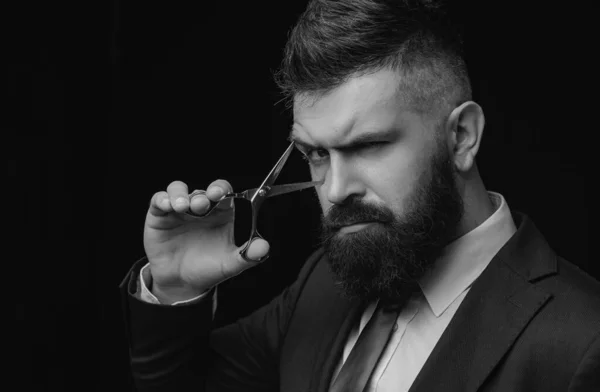 Perfect beard. Haircuts for men. Stylish and hairstyle. Hair salon and barber vintage. Barber shop. Barber on black background with scissors
