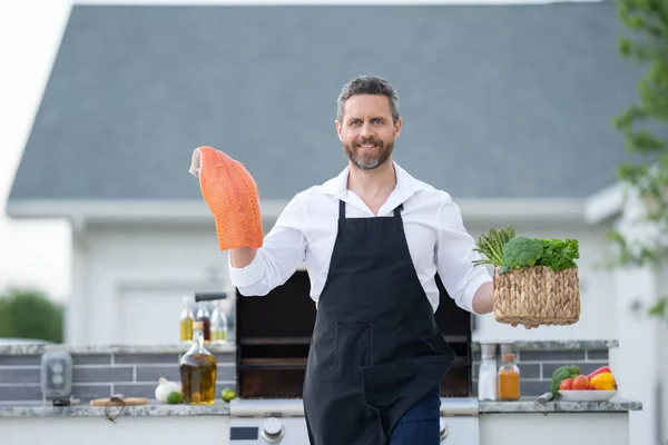Barbecue Master Chef Apron Hold Salmon Fillet Bbq Millennial Man — Stock Photo, Image
