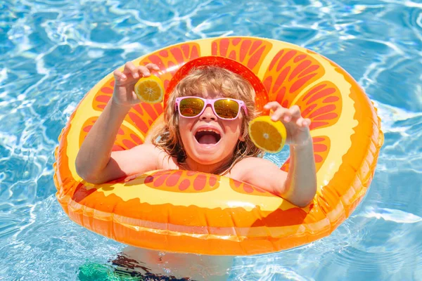 stock image Fun child portrait. Child playing in swimming pool. Summer vacation concept. Summer kids portrait in sea water on beach