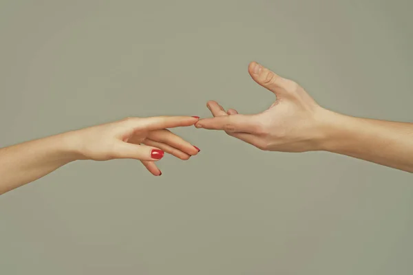 Touch of two hands. Man and woman hand about to touch with index finger. Couple in love reaching to each other. Hand try to touch. Couple hands reaching towards each other. Couple hand touch