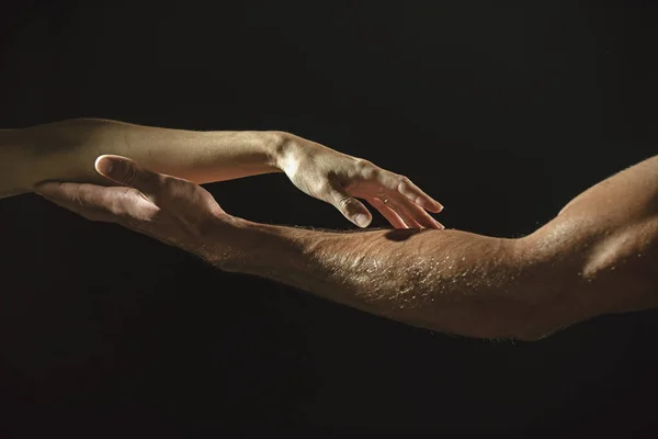 Reaching touching hands. Reach hand. Sensual touch fingers. Two hands trying to touch. Hands of man and woman reaching to each other. Hand try to touch. Fingers touch each other. Sensual arm