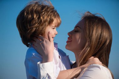 Mother kiss. Closeup portrait of mother and child kissing. Mother hugging and embracing son. Mothers day, love family. Mother and child with tenderness. Mothers kiss child, cuddle warm relationships