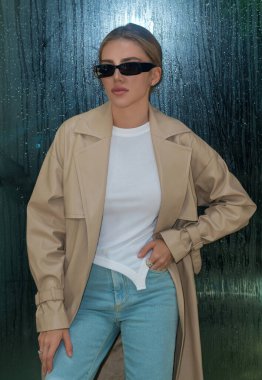 Fashion model woman on street. Coat style