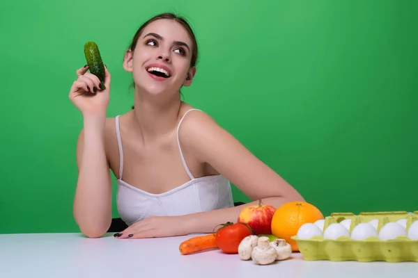 Vegetables diet. Happy smiling woman eating healthy food, dieting. Girl eating vegetable diet salad in studio. Vegan salad. Female on diet. Dieting concept. Healthy lifestyle. Diet for weight loss