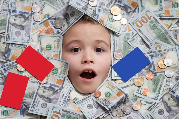 Child head in money. Fun kid face on dollars money. Cash dollars banknotes, coins and credit card