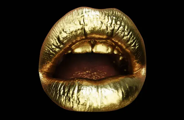 Gold lips. Gold paint from the mouth. Golden lips on woman mouth with make-up. Sensual and creative design for golden metallic. Beauty and fashion