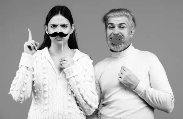 Identity transgender, gender stereotypes. Woman with moustache and man with red lips. Couple gender equality