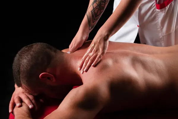 Sports Massage Physical Therapyst Massaging Neck Shoulder Muscular Male Athelete — Stock Photo, Image