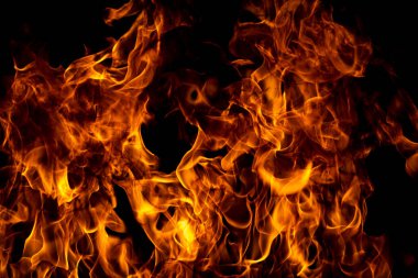 Yangın alevi siyah arkaplanda izole edildi. Alevler, soyut doku. Ateş deseni için sanat tasarımı, alev dokusu