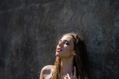 Beautiful young woman with clean fresh skin, summer outdoor. Face care, facial treatment, cosmetology, beauty and spa. Sensual women portrait. Fashion make up