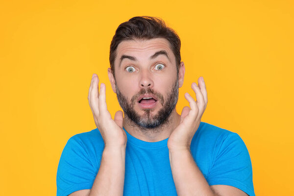 Portrait of shocked unshaven caucasian man afraid and shocked with surprise expression, fear and excited face. Emotion people. Shocked man with great disbelief, expresses surprisment and astonishment