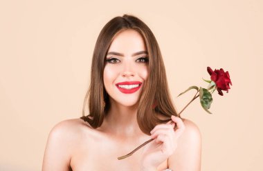 Closeup fresh face girl. Fashion portrait of young beautiful woman with naked shoulder and red rose. Beauty spring