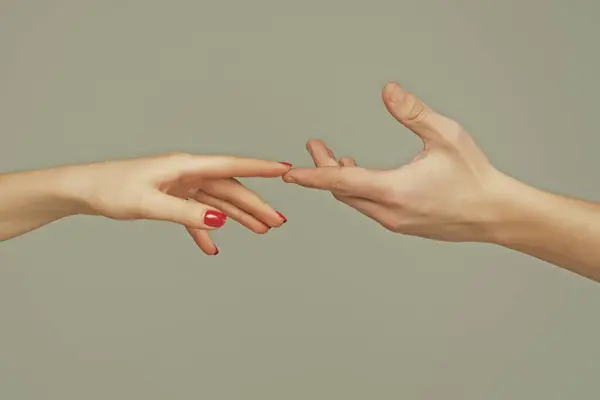 Reaching touching hands. Reach hand. Sensual touch fingers. Two hands trying to touch. Hands of man and woman reaching to each other. Hand try to touch. Fingers touch each other. Sensual arm