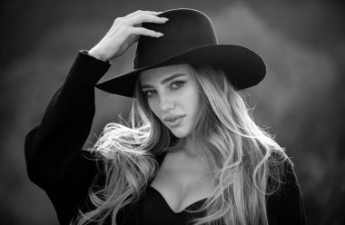 Autumn romantic casual woman portrait in fashion brim black hat. Beautiful girl outdoor, close up beauty young female face. Trendy autumn fall hat