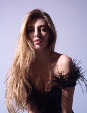 Sexy attractive woman with slim sexy body posing in fashion dress in studio. Beautiful sexy model portrait. Beauty woman face. Attractive sensual girl