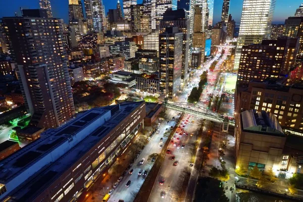 Night New York City, Manhattan famous top view. Manhattan from above. NYC panorama. NYC skyline at twilight. New York famous building. Night traffic in NYC. Lower Manhattan. Night NYC from drone