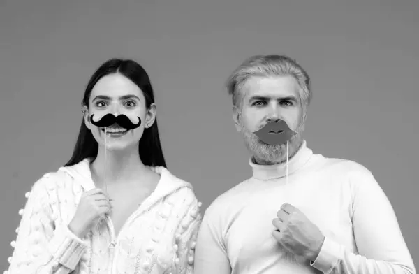 Gender, equality diversity concept. Male female portrait. Transgender gender identity, equality and human rights. Funny couple of woman with moustache and man with red lips