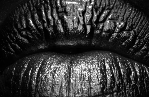Macro close up golden sexy lips, golden art. Gold bright make-up in lips