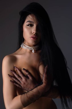 Beautiful sensual young woman with clean skin and natural makeup. Beautiful model, sexy girl face. Fashion and beauty. Sensual girl with naked sexy body. Natural female beauty and sexy concept