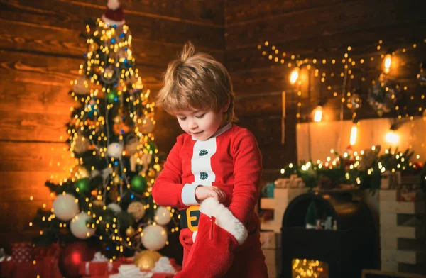 Kid Boy Santa Hold Christmas Gift Red Sock Childhood Moments — Stock Photo, Image