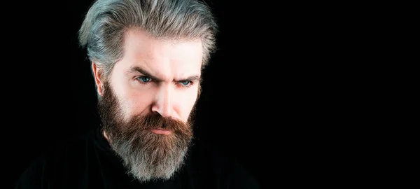 Bearded middle aged man with classic long beard, bearded gay. Barber barbershop. Mustache men, serious face close up, isolated on black. Templates web banner design. Horizontal banner for website