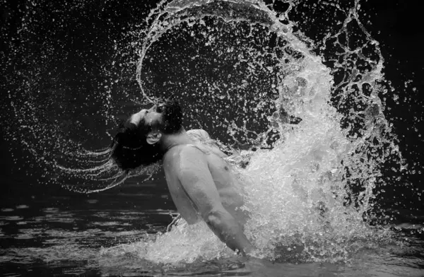 Carefree and positive thinking. Man splashing water by hair. Summer weekend