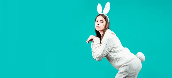 Easter banner with bunny woman. Funny girl with Easter bunny ears on Easter card on isolated background