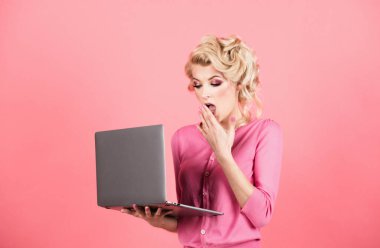 Surprised business woman face. Young business woman isolated on studio background. Woman with laptop pc computer