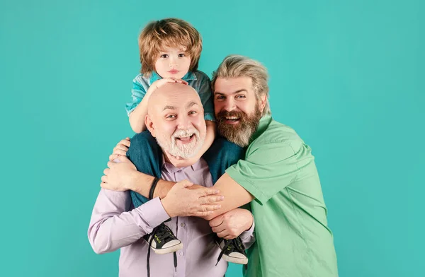 Grandfather father and son hugging and embracing isolated. Fathers day concept. Men in different ages cuddling bonding. Family tenderness hug, child love, affectionate