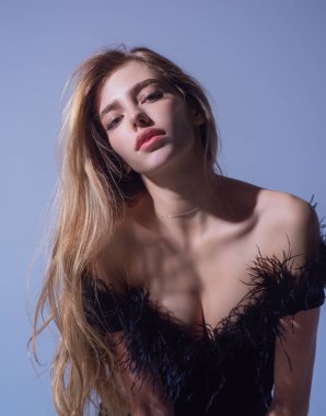 Seductive sexy lovely attractive young sensual woman in fashion black dress and perfect slim body posing on gray studio background. Beautiful elegant fashion model, studio portrait. Beautiful face