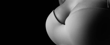 Lingerie model. Women breasts. Sexy breas, boobs in bra, sensual tits. Beauty slim female body. Closeup of sexy girl boob in black bra, copy space