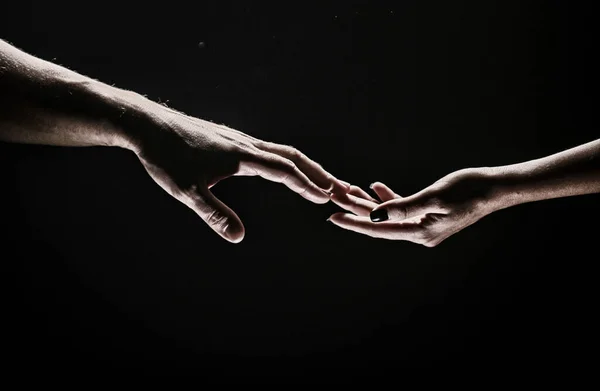Hands at the time of rescue. Friendly handshake, friends greeting, teamwork, friendship. Rescue, helping gesture or hands. Romantic touch with fingers, love