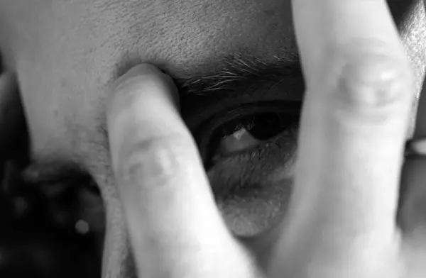 Close up portrait of handsome man. Guy covered face with hands and doing stop gesture with sad and fear expression