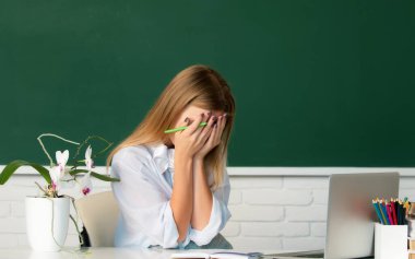 Female shame embarrassed student on lesson lecture in classroom at high school or college